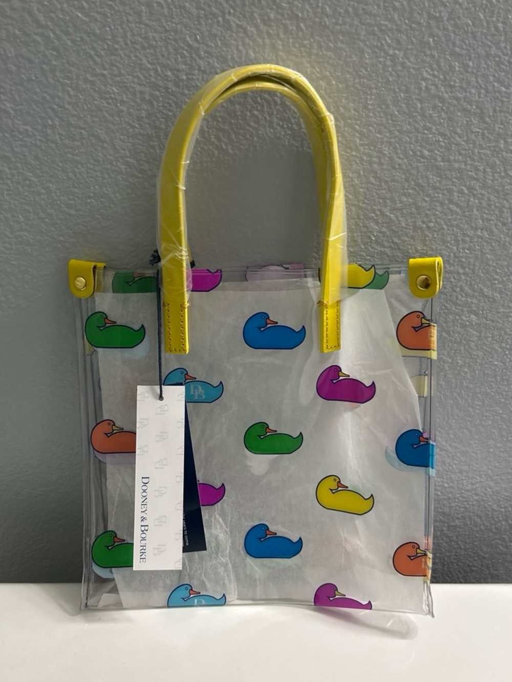 Dooney & Bourke Clear Tote with Yellow Handles and Multicolor Duck Prints